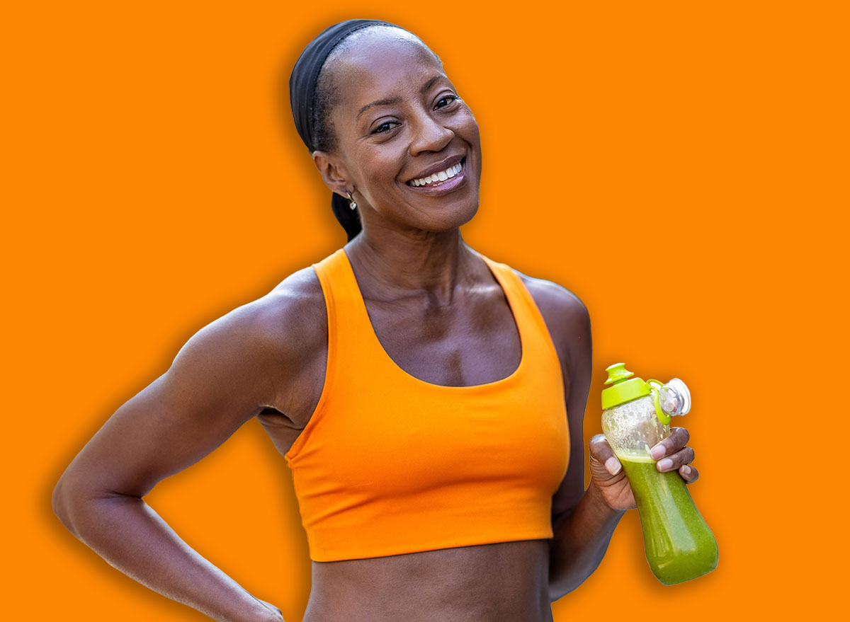 Woman drinking green smoothie after fitness running workout 