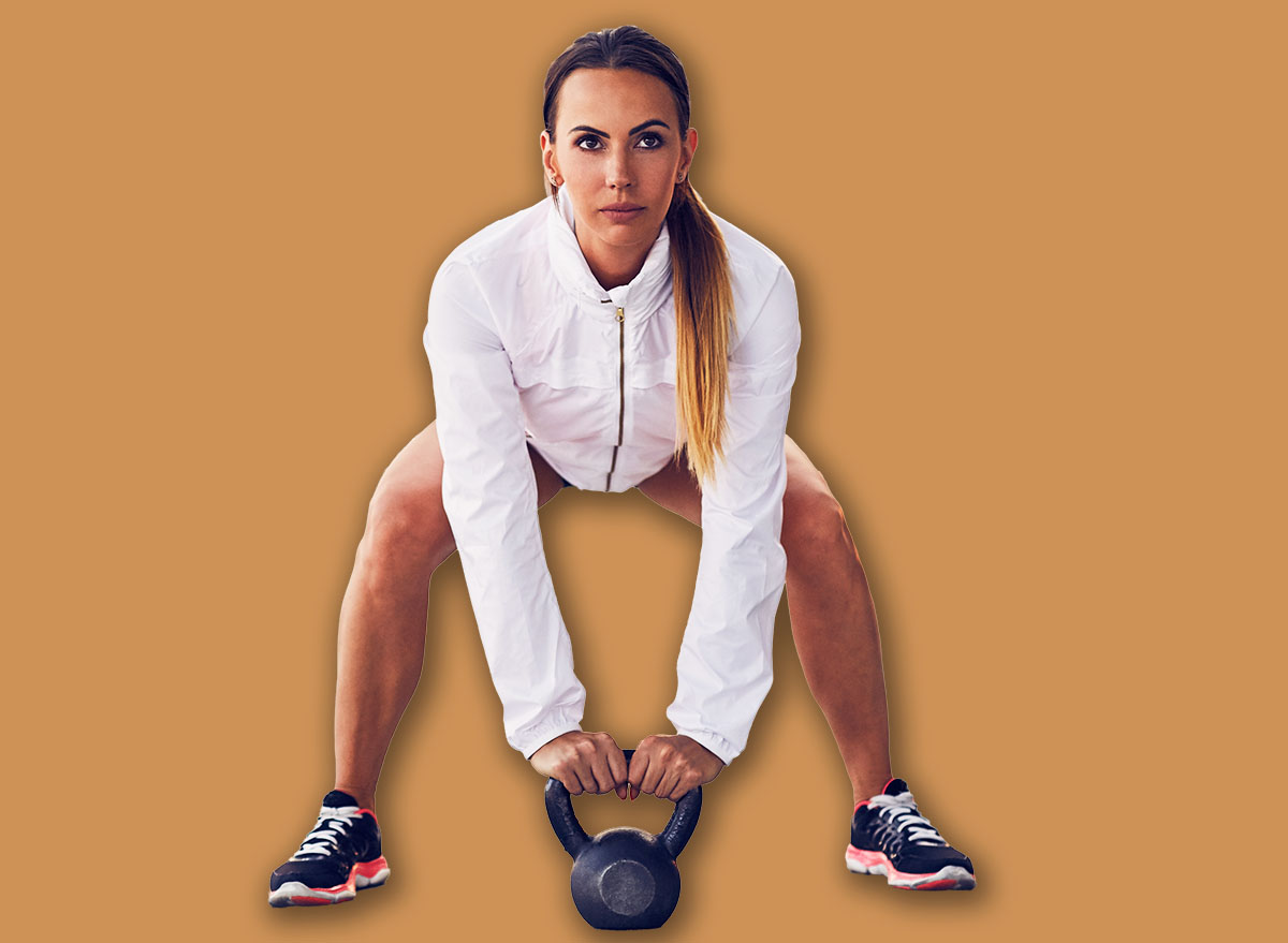 Woman before kettlebell swing cross fit exercise